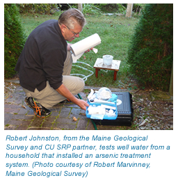 Photo of Robert Johnson from the Maine Geological Survey testing well water.