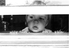 Toddler at window.