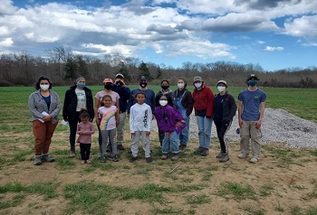 Brown SRP trainees, researchers, and community members take safety precautions during community volunteer days.