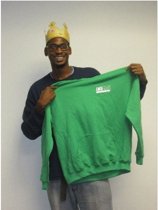 Trainee poses with a smile while he is recognized as trainee of the week. (Photo courtesy of Kentina Kellum)