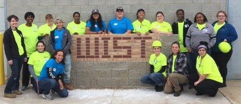 Program attendees had the opportunity to lay brick to build the brick WIST sign. (Photo courtesy of Steve Surtees, CPWR)