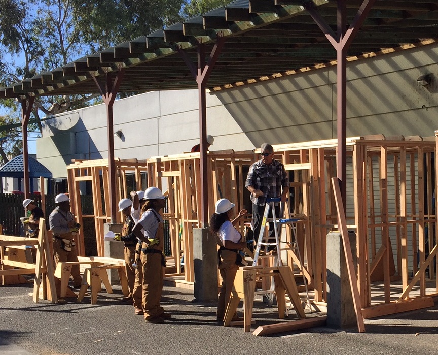 Trainees practice their carpentry skills building small houses in East Palo Alto, California. (Photo courtesy of Steve Surtees, CPWR)