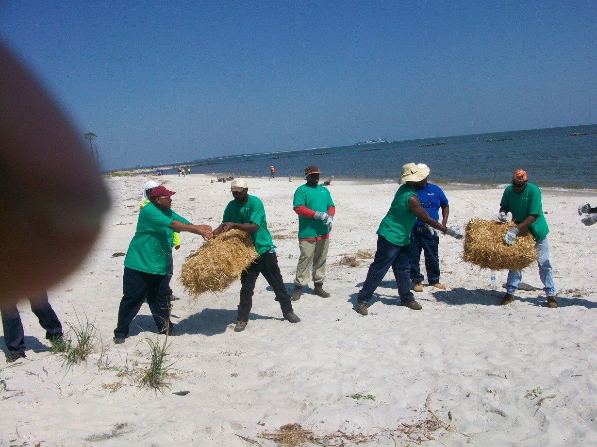 Trainees and volunteers helping with cleanup activities following the Deepwater Horizon Gulf Oil Spill. (Photo courtesy of Deep South Center for Environmental Justice).