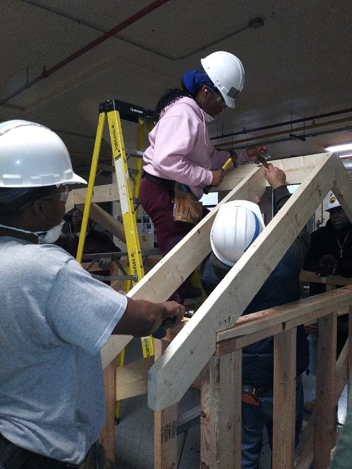 Trainees participating in a carpentry class. (Photo courtesy of Kentina Kellum, OAI, Inc.).