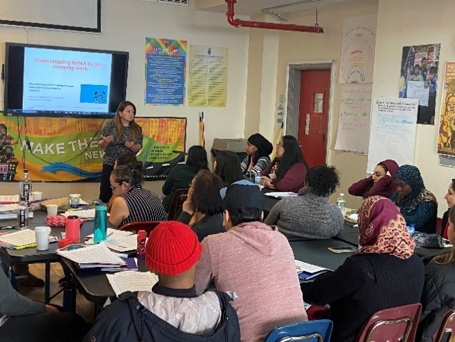 Program Lead Maiber Solarte teaches a class to community health workers on understanding the Health Insurance Portability and Accountability Act. (Photo courtesy of Maiber Solarte, Make the Road New York). 
